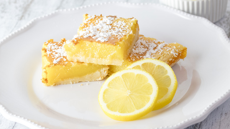 lemon bars on white plate