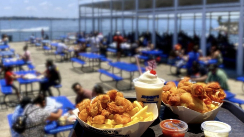 Johnny's outside dining with lunch on display