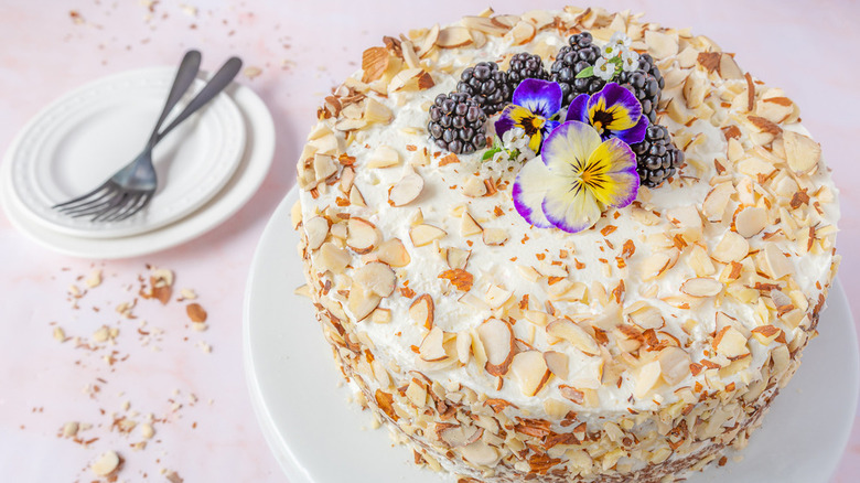 almond cake with floral and berry topping