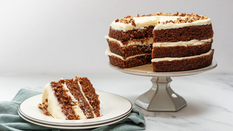 layered carrot cake slice on plate