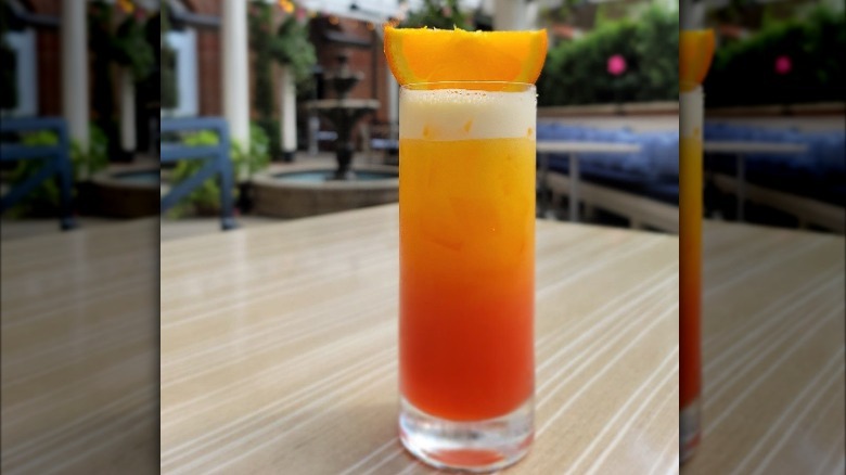 Garibaldi cocktail with orange wedge