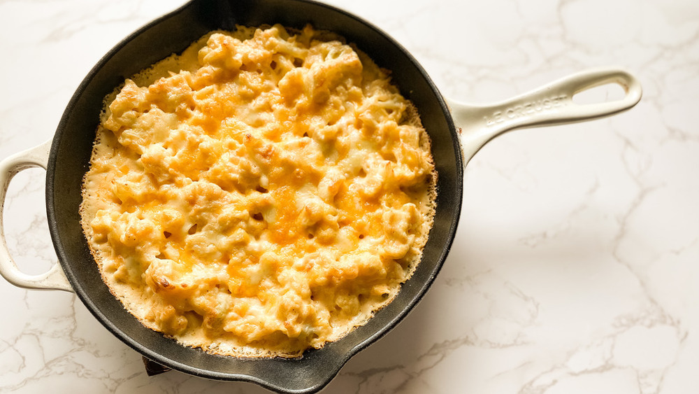 cauliflower mac and cheese in a cast iron skillet