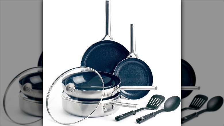 cookware set with stainless steel handles and dark blue interior