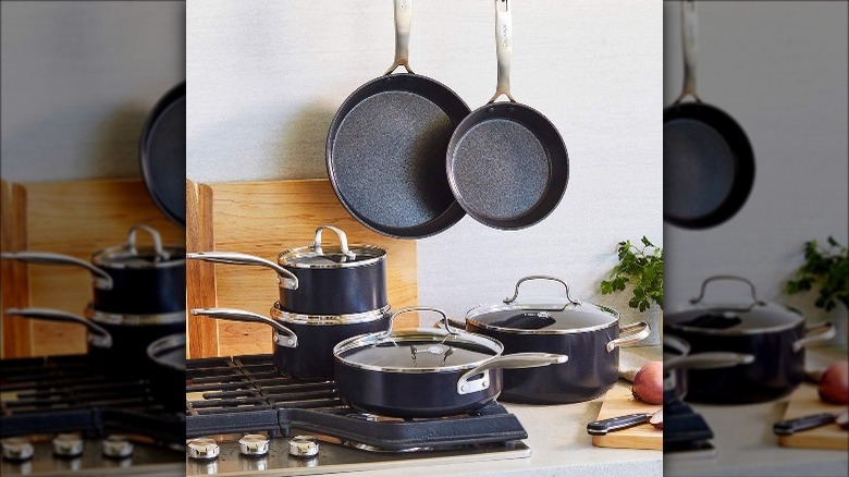 cookware set arranged on counter and stovetop