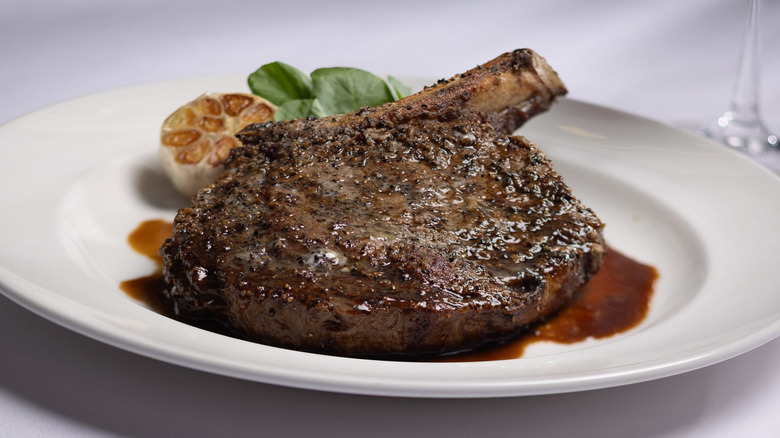 Capital Grille steak on plate with garlic