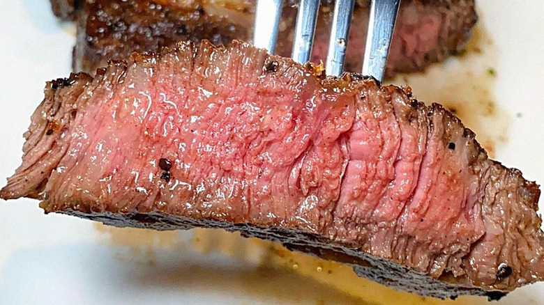 Piece of Fleming's steak on fork