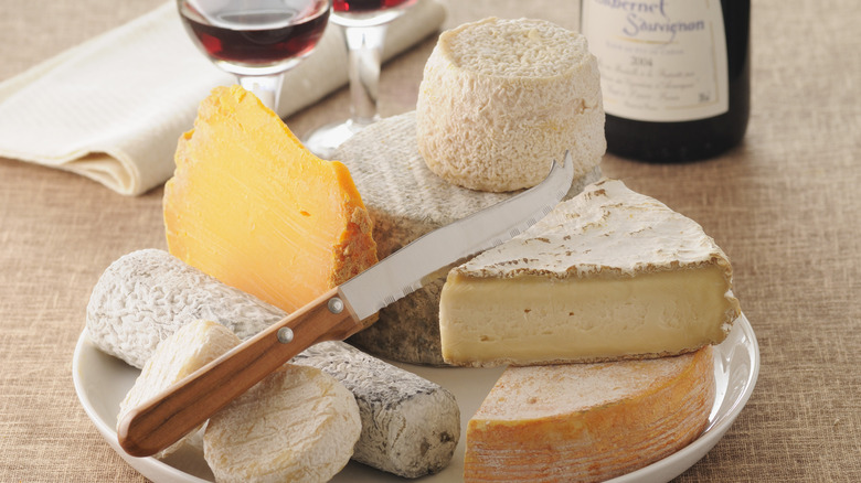 assorted cheeses and wine 