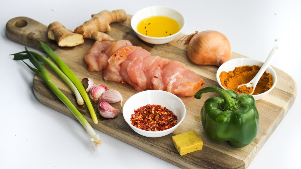 chicken curry ingredients on cutting board