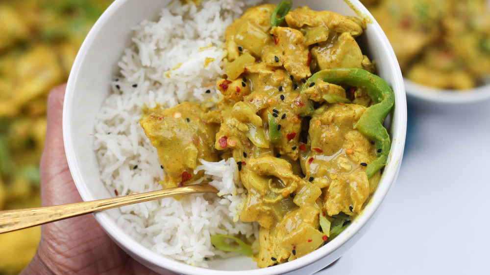 chicken curry in bowl with spoon