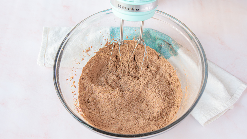 mixing dry ingredients for chocolate peanut butter cupcakes