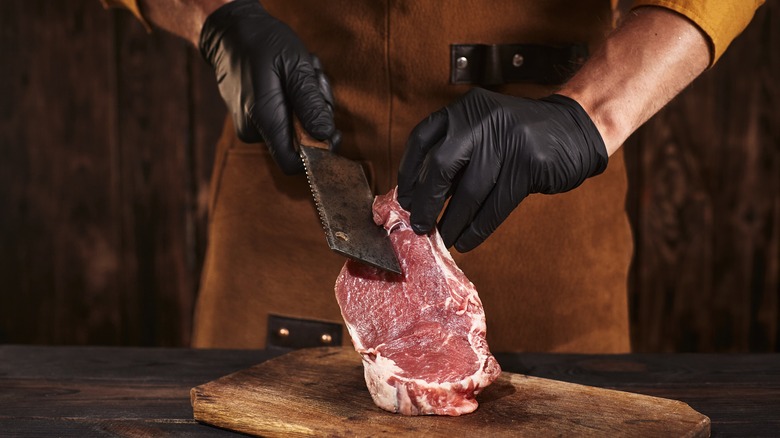 Man using a kitchen cleaver 