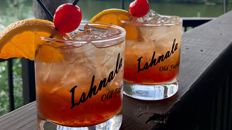 Old Fashioned cocktails on wooden deck