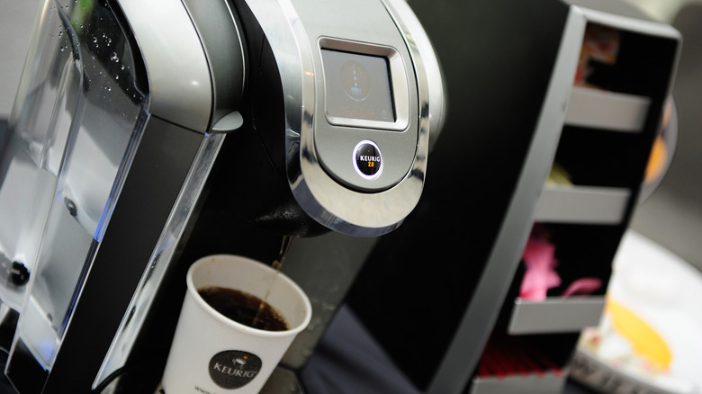 Keurig machine brewing coffee