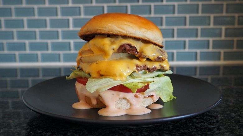 burger on a plate in kitchen