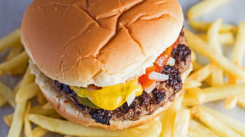 burger sitting on top of fries