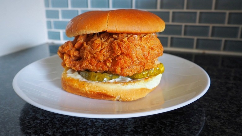 giant fried chicken sandwich on plate