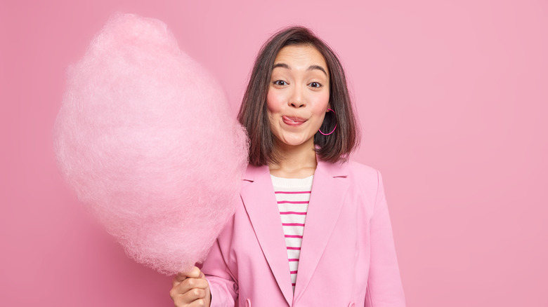 woman holding cotton candy