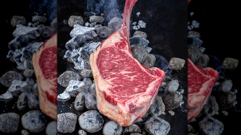 Tomahawk steak on hot coals