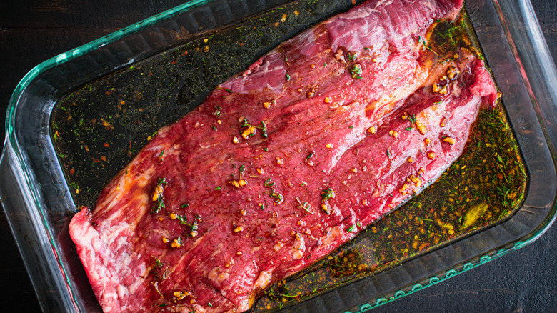 raw flank steak in marinade