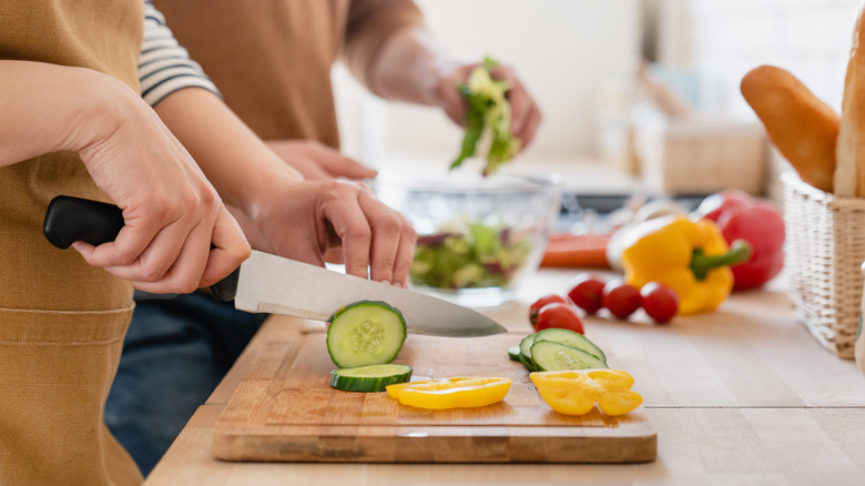 Cucumber being chopped