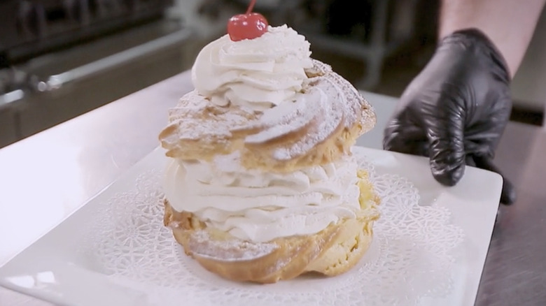 Giant cream puff with cherry on top