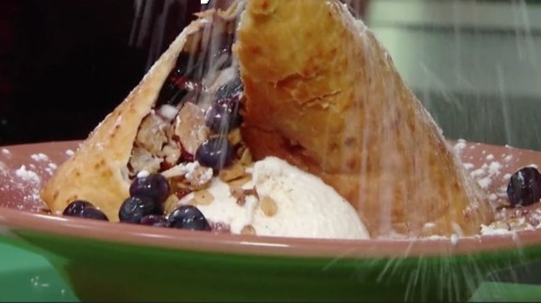 Fried tortilla and blueberries with ice cream