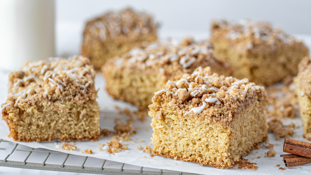 squares of cinnamon streusel coffee cake cooling on a wire rack