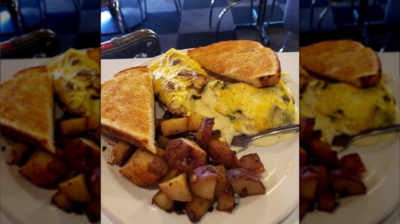 Cheesy omelet, home fries, and toast