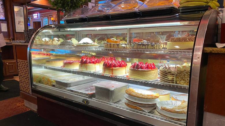 Dessert case full of cakes