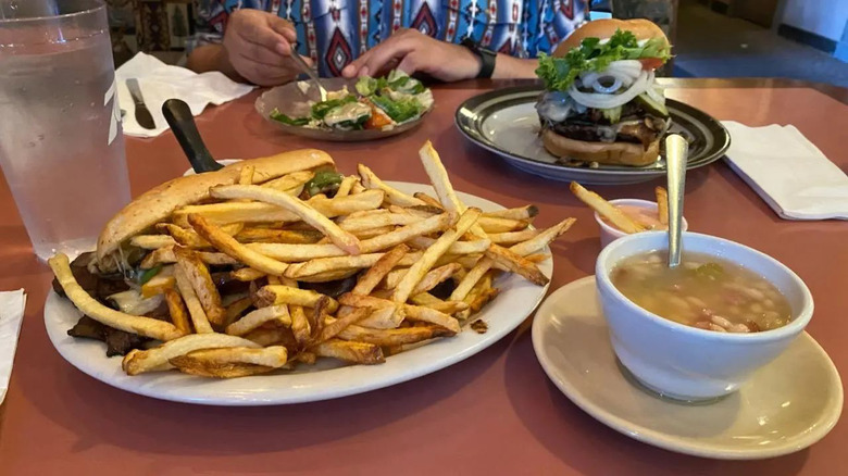 Sandwich, French fries, and bowl of soup