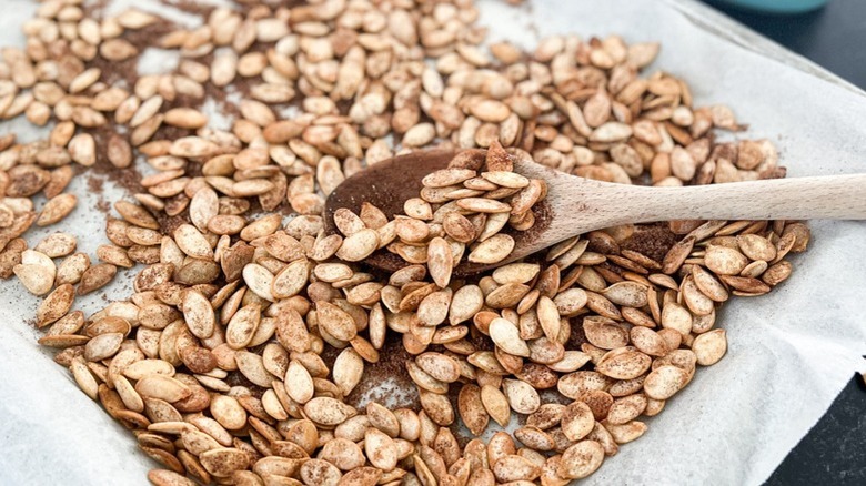 pumpkin seeds with wooden spoon