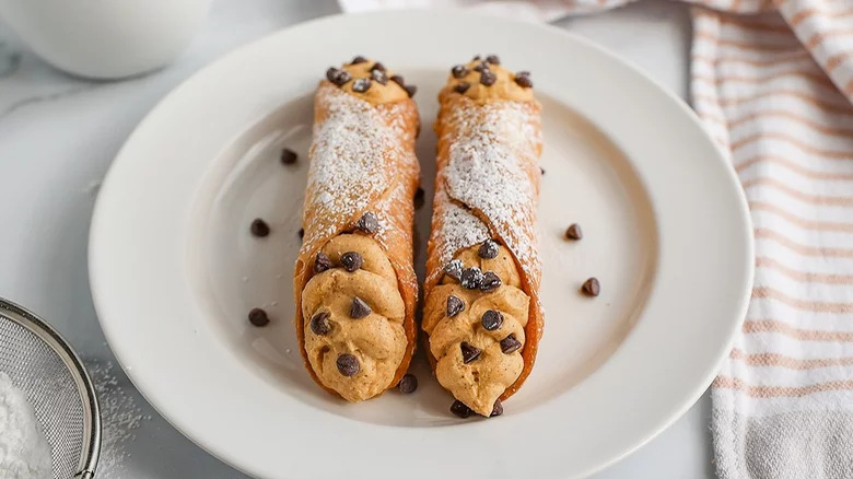 Two pieces of cannoli on a plate