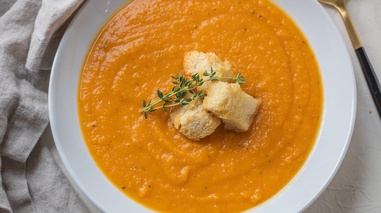 squash soup in white bowl