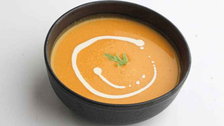 squash soup in black bowl