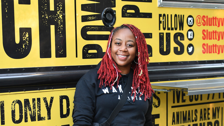 Pinky Cole smiling by food truck