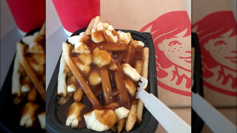 Poutine beside Wendy's bag