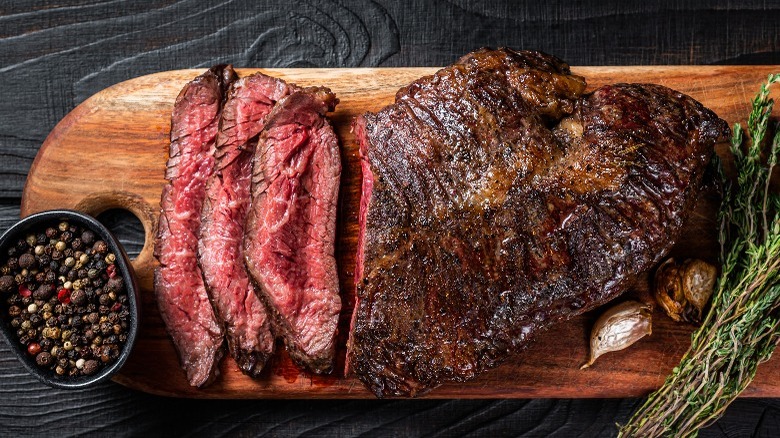 sliced steak on cutting board