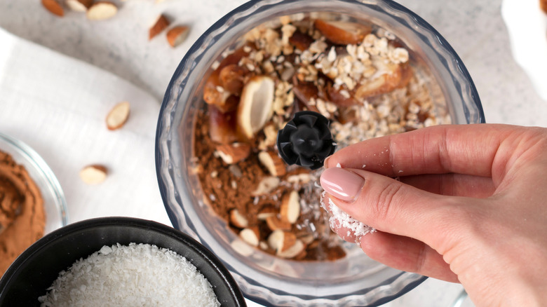 adding coconut to food processor