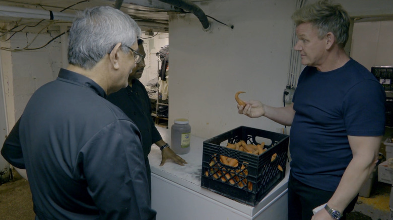 Gordon Ramsay examines a crate of carrots