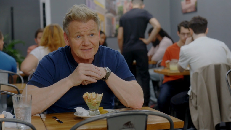 Ramsay sitting over a glass of ceviche