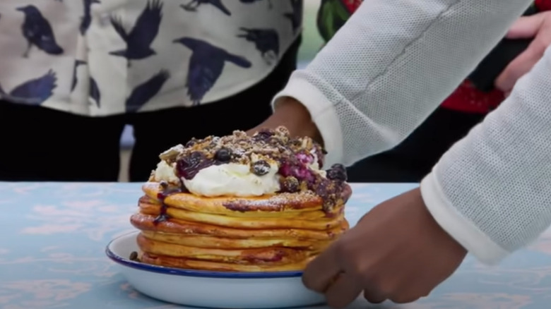 Liam presenting cake on GBBO