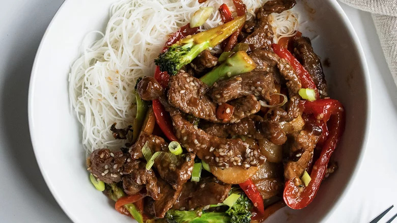 Noodles and beef stir fry in a plate