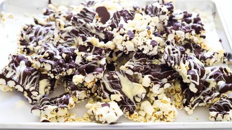 Candy bark made with popcorn, white chocolate and dark chocolate.