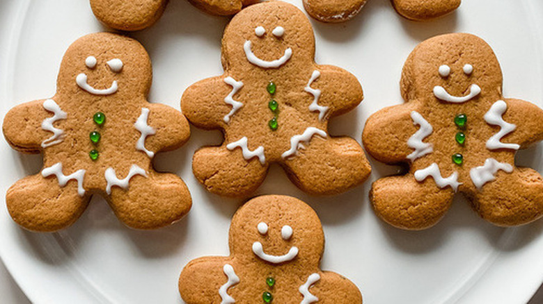 Gingerbread men cookies with white and green icing.