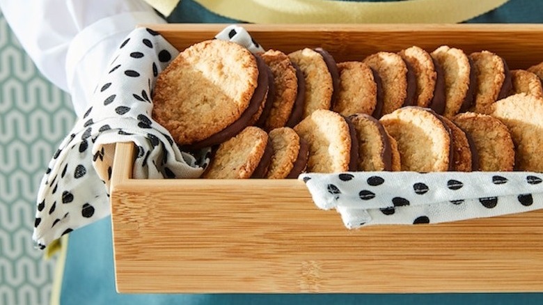 Person holding oatmeal cookies