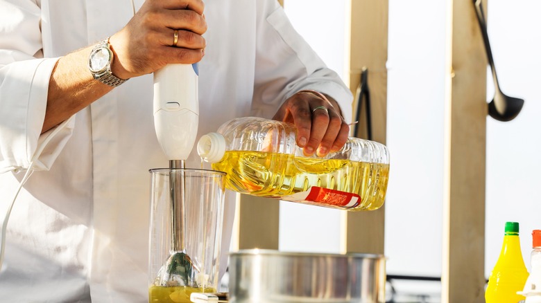 Man cooking with immersion blender