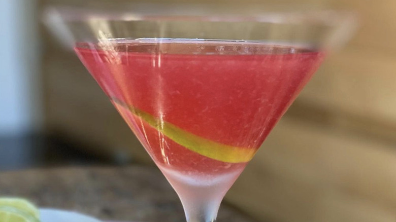 Pink pomegranate gimlet in glass 