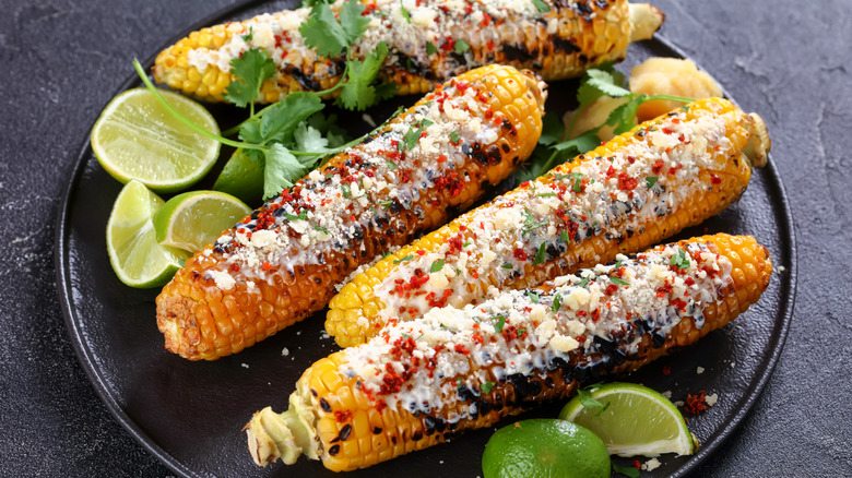 Elotes covered with cilantro