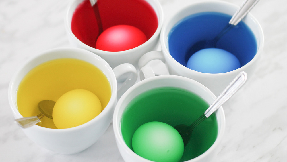 Hard-boiled eggs soaking in colored dye