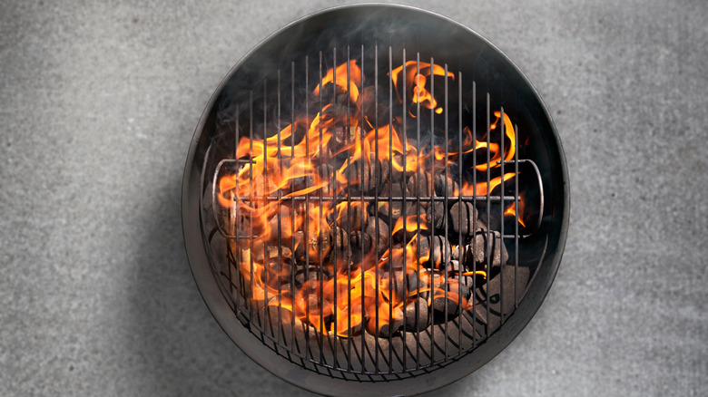 Charcoal grill with flames